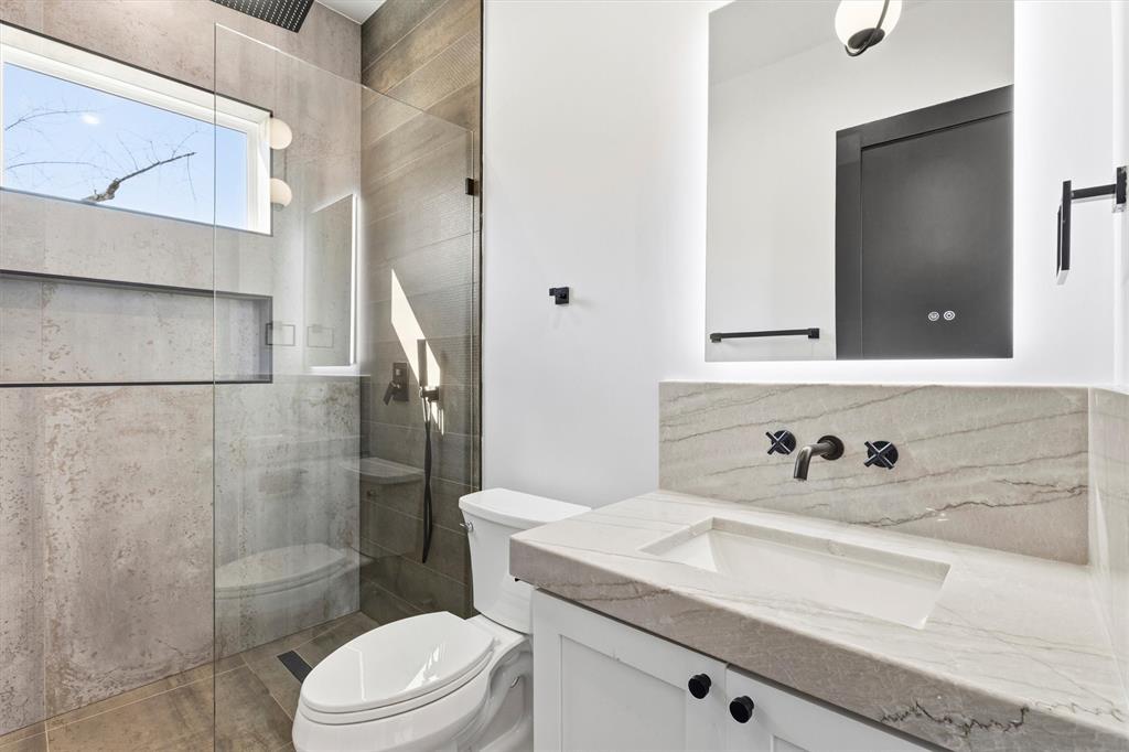 6257 Turner Way Dallas, TX 75230 - Photo 35 of 39 a bathroom with a sink a toilet and shower