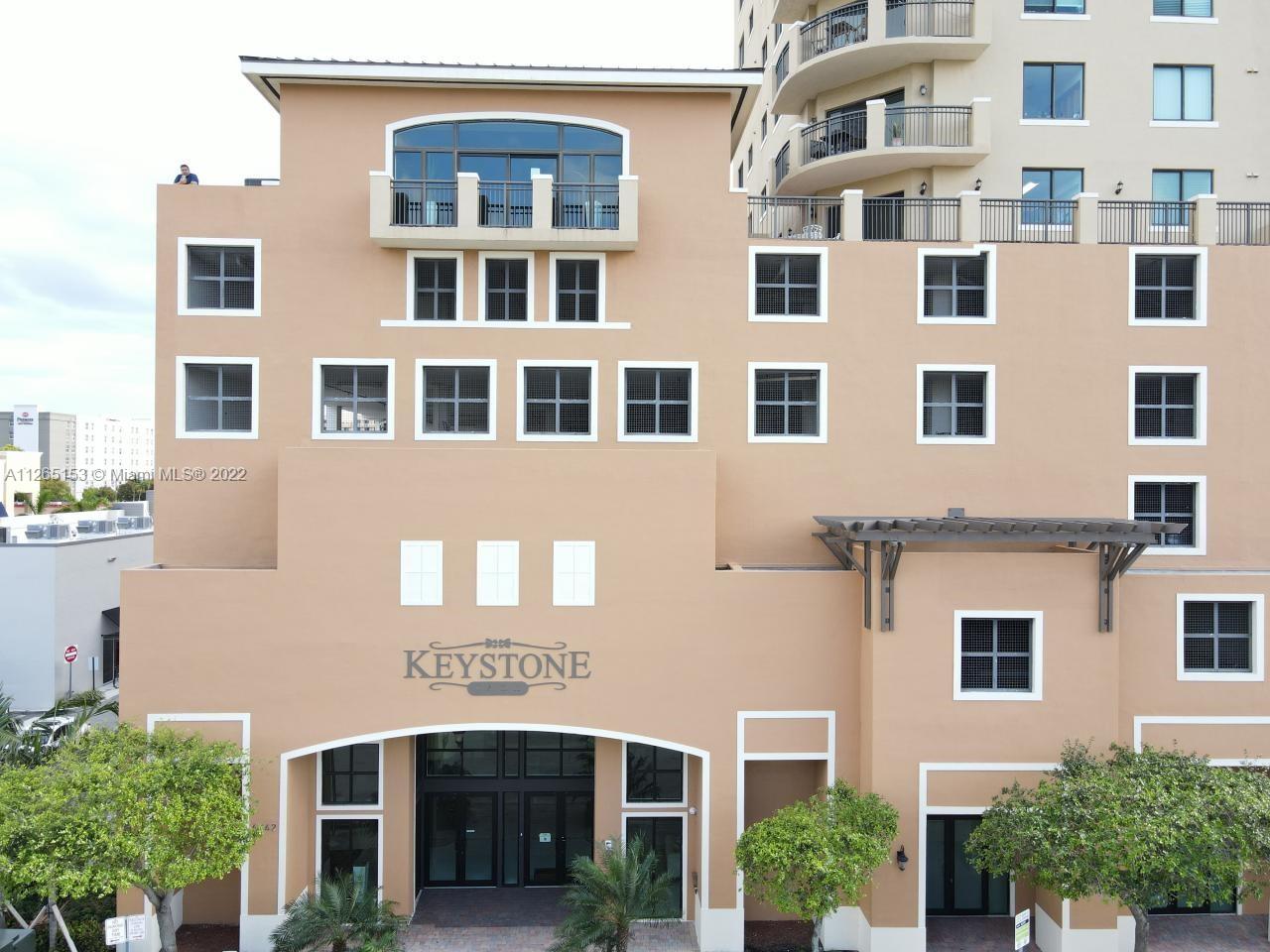 a front view of a building with a lot of windows