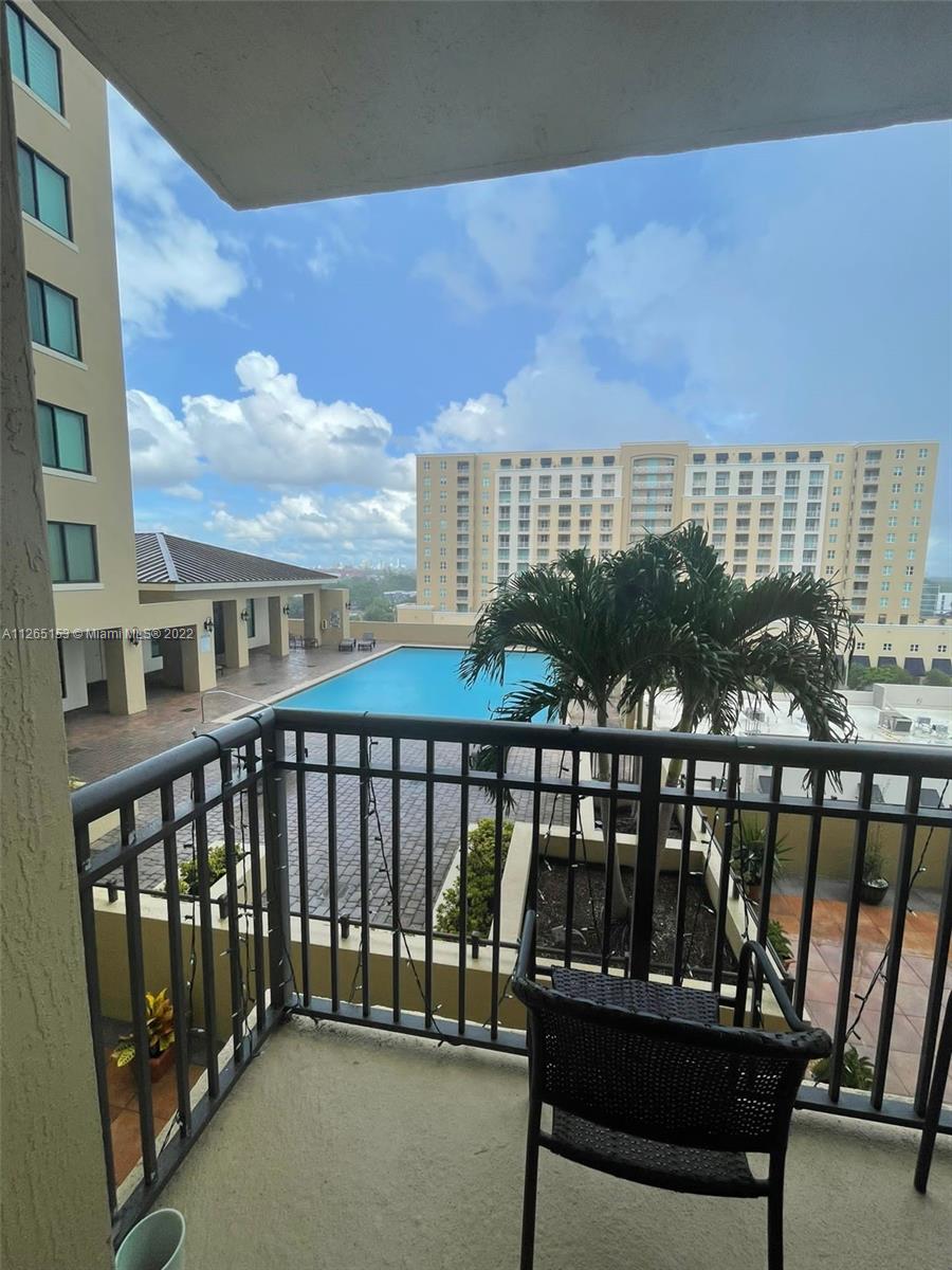 4242 Northwest 2nd Street, Unit 708 Miami, FL 33126 - Photo 15 of 20 a view of a balcony with a couple of chairs