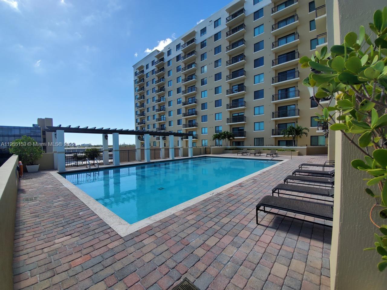 4242 Northwest 2nd Street, Unit 708 Miami, FL 33126 - Photo 20 of 20 a view of a swimming pool with a terrace