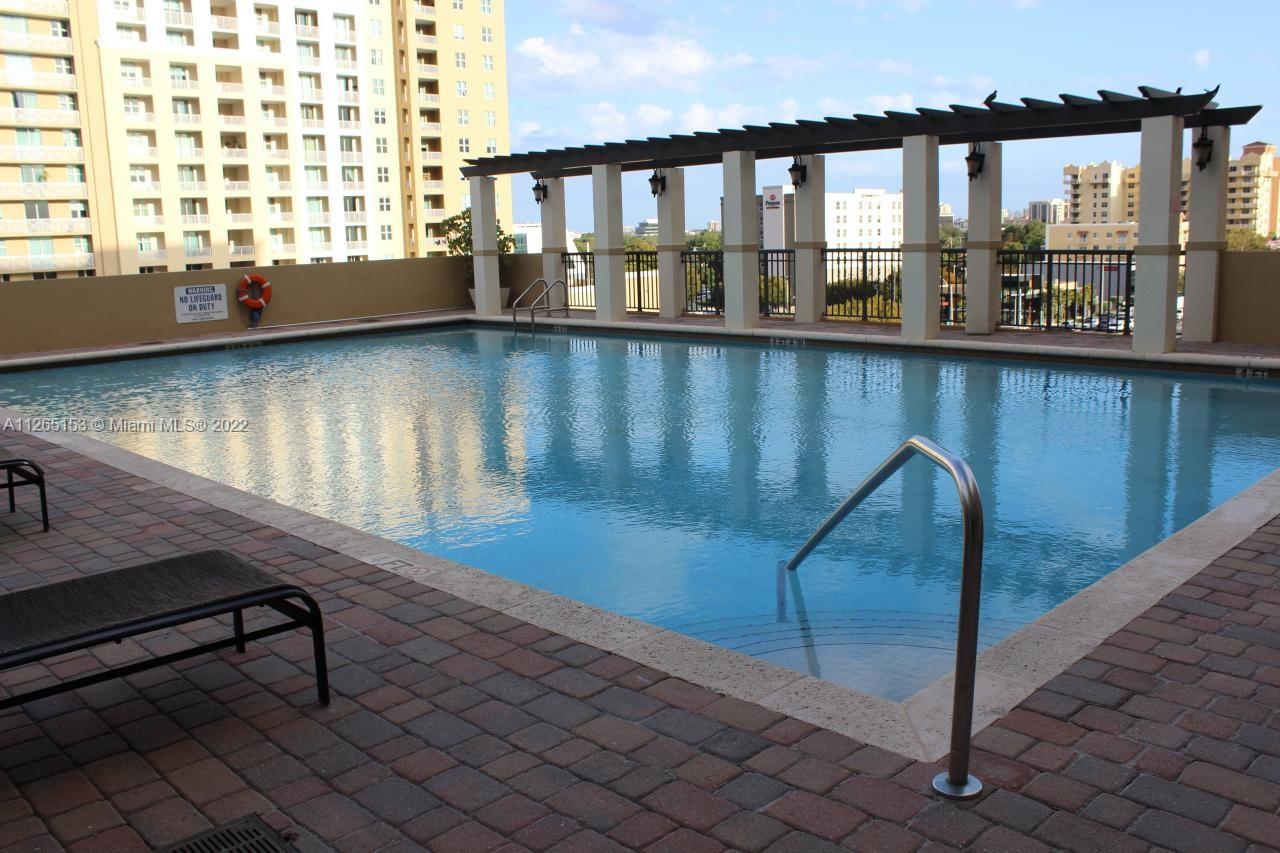 4242 Northwest 2nd Street, Unit 708 Miami, FL 33126 - Photo 2 of 20 a view of a room with lots of windows