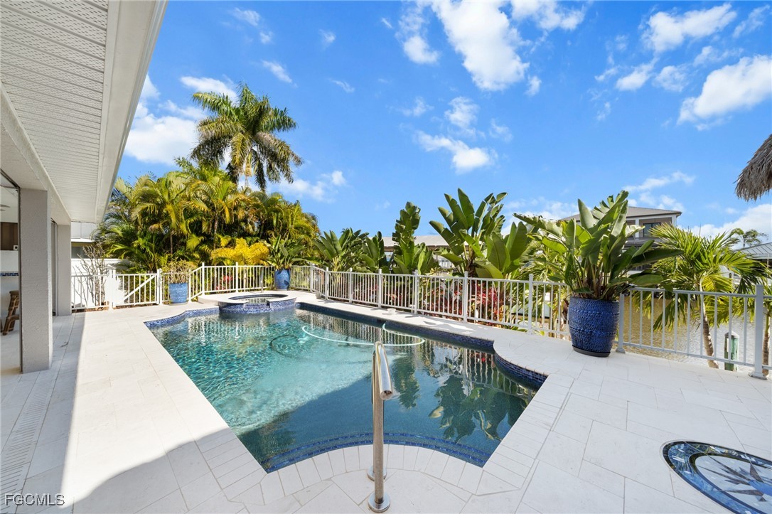 12234 Boat Shell Drive Matlacha Isles, FL 33991 - Photo 26 of 50 a view of a swimming pool with a patio