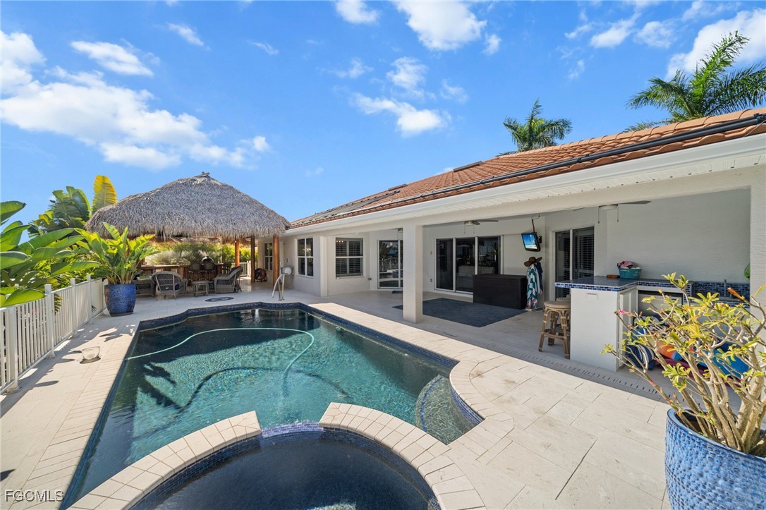 12234 Boat Shell Drive Matlacha Isles, FL 33991 - Photo 29 of 50 a view of a house with swimming pool and sitting area