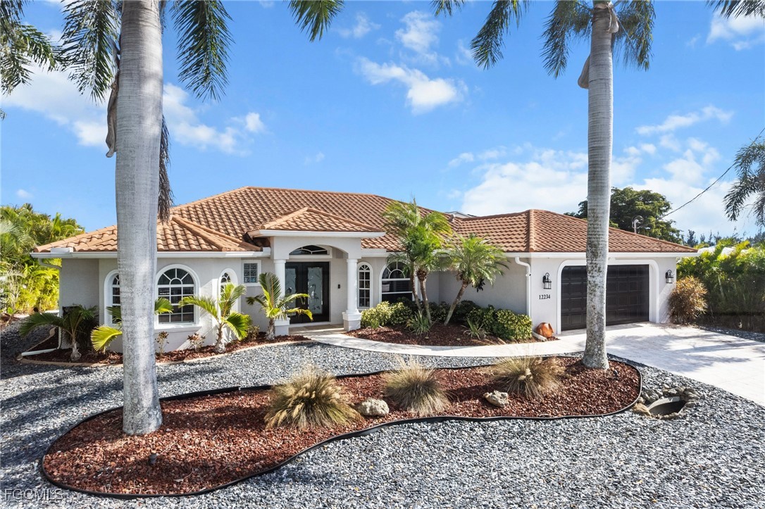 12234 Boat Shell Drive Matlacha Isles, FL 33991 - Photo 39 of 50 a front view of a house with entertaining space