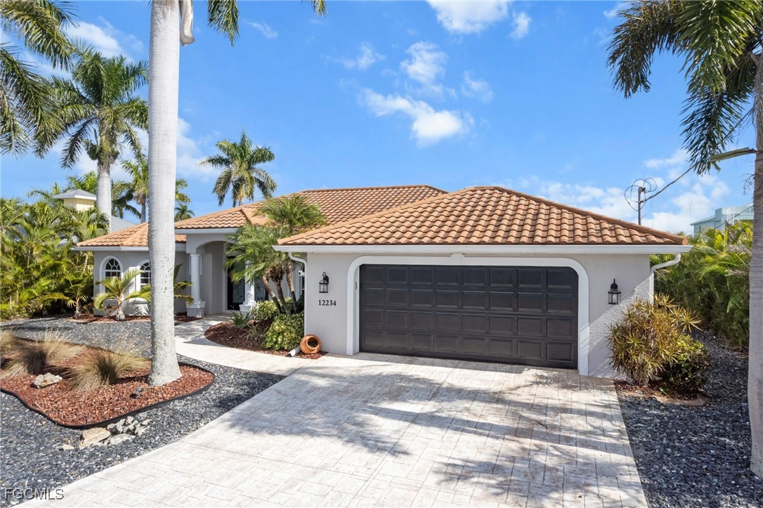 12234 Boat Shell Drive Matlacha Isles, FL 33991 - Photo 40 of 50 a front view of a house