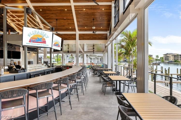 12234 Boat Shell Drive Matlacha Isles, FL 33991 - Photo 42 of 50 a outdoor dining space with furniture