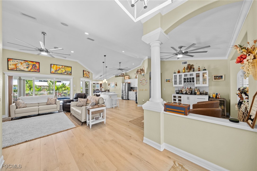 12234 Boat Shell Drive Matlacha Isles, FL 33991 - Photo 6 of 50 a living room with furniture and a flat screen tv