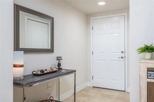 a room with a table and mirror