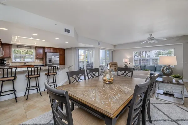 a dining room with furniture and window
