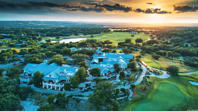 an aerial view of house with yard swimming pool and outdoor seating