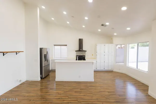 a bathroom with a tub sink shower and mirror