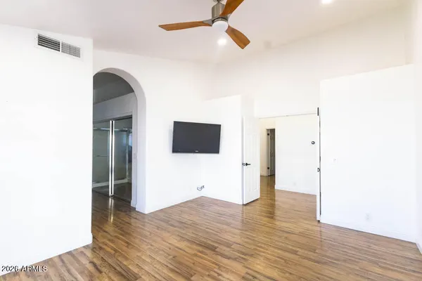 a view of hallway with wooden floor