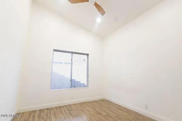a view of a workspace with furniture and wooden floor