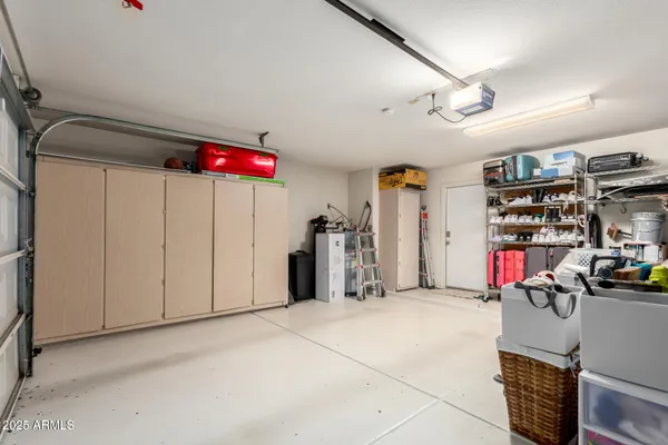 a view of backyard of house with green space