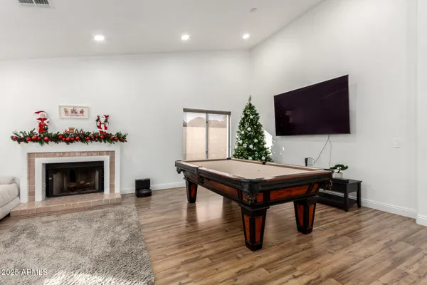 a kitchen with granite countertop a stove top oven a sink a counter space and cabinets
