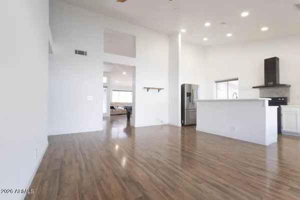 a kitchen with a sink a stove a refrigerator and a cabinets