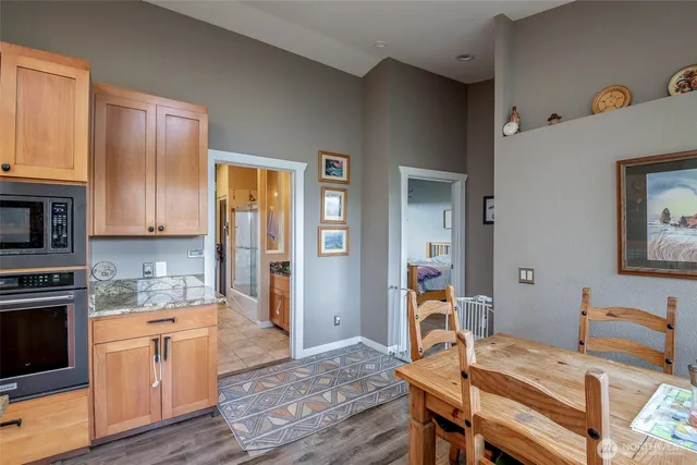 a view of a kitchen with workspace and wooden floor