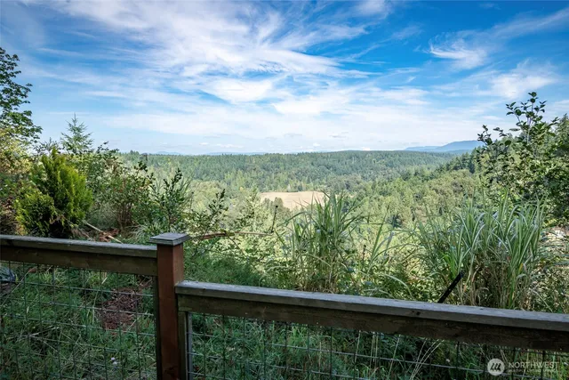 a sitting area with furniture and a yard