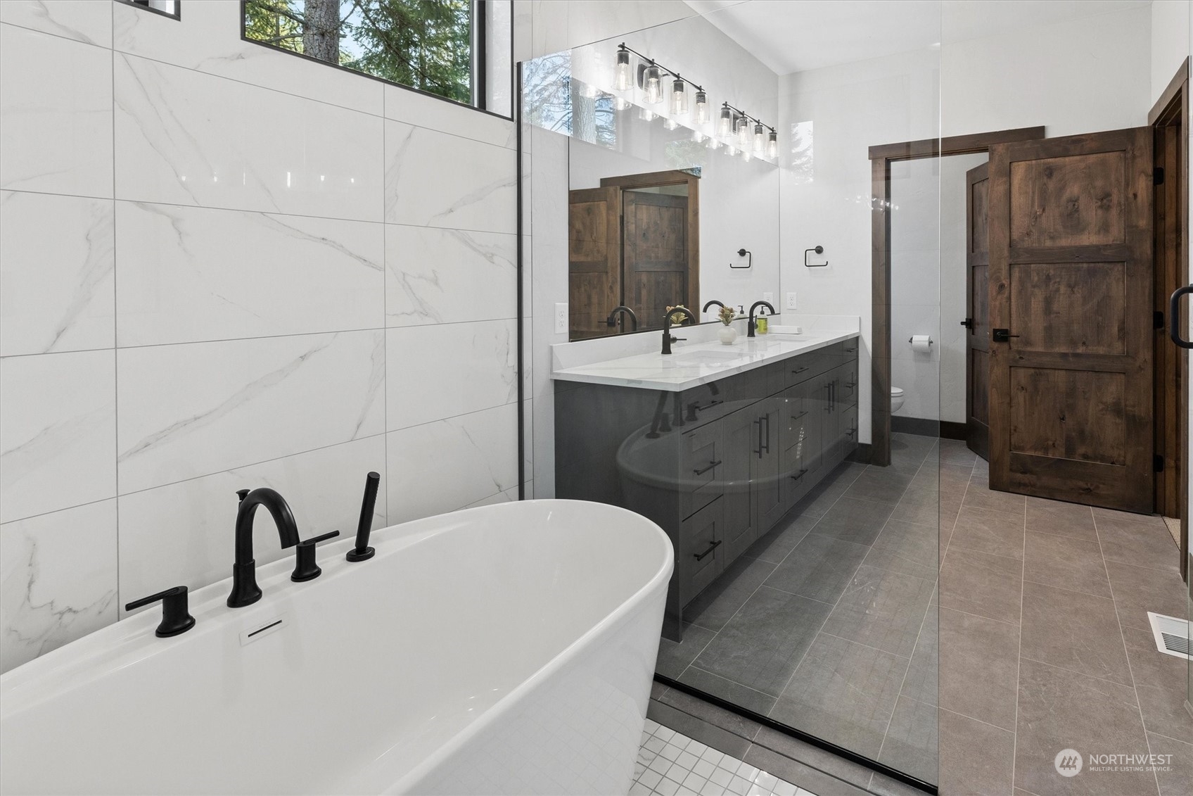 1810 Larkspur Loop Cle Elum, WA 98922 - Photo 13 of 35 a bathroom with a double vanity sink a toilet a mirror and shower