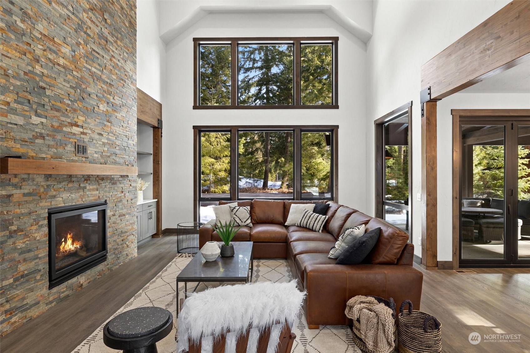 1810 Larkspur Loop Cle Elum, WA 98922 - Photo 5 of 35 a living room with furniture a fireplace and a large window