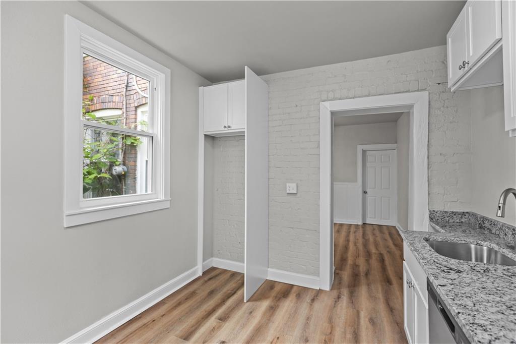 1238 Church Avenue McKees Rocks, PA 15136 - Photo 15 of 25 a bedroom with a bed and a dresser next to a window