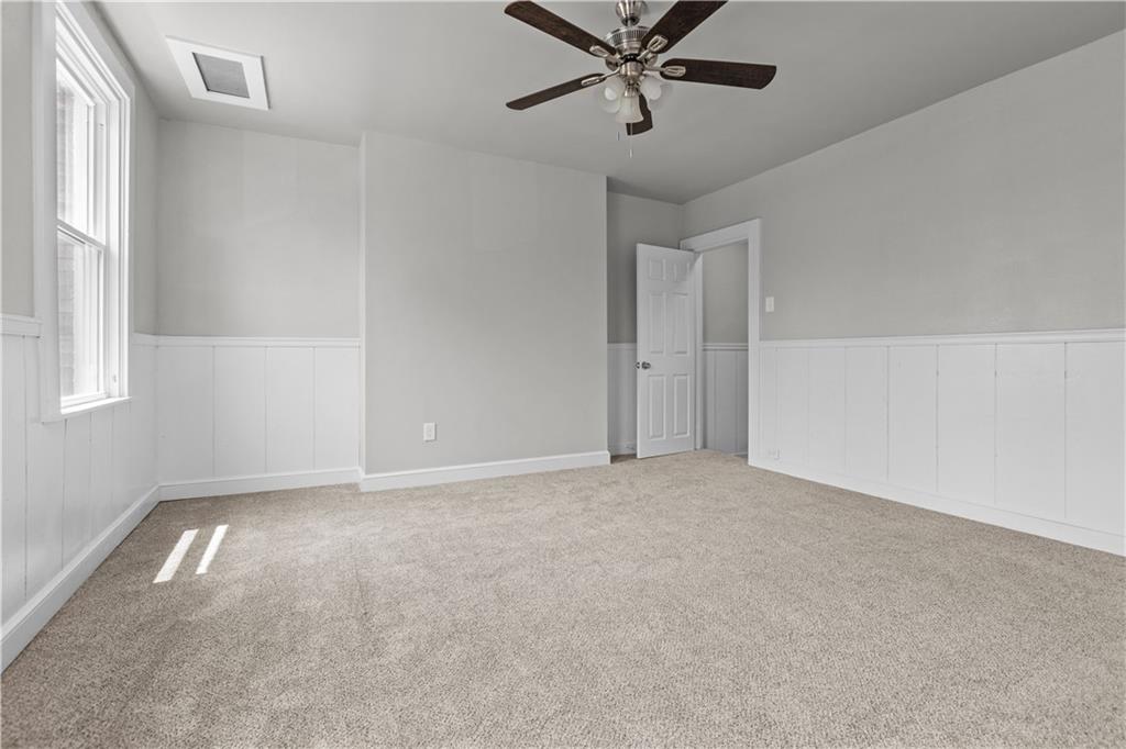 1238 Church Avenue McKees Rocks, PA 15136 - Photo 18 of 25 an empty room with a window and a fan