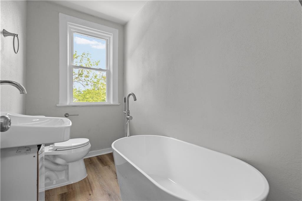 1238 Church Avenue McKees Rocks, PA 15136 - Photo 21 of 25 a white bath tub sitting next to a white toilet
