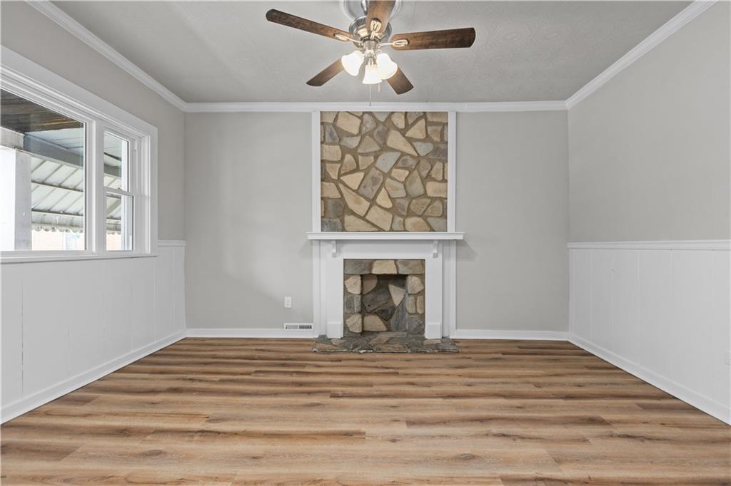 1238 Church Avenue McKees Rocks, PA 15136 - Photo 5 of 25 a view of a livingroom with a fireplace and chandelier fan