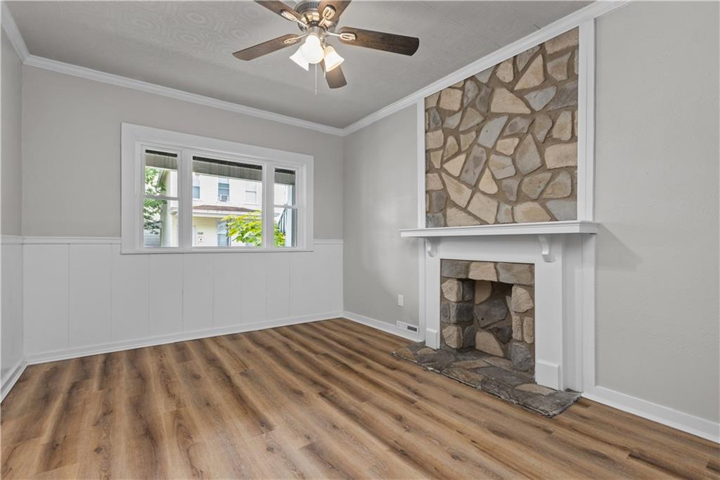 1238 Church Avenue McKees Rocks, PA 15136 - Photo 6 of 25 a view of an empty room with a window and fireplace