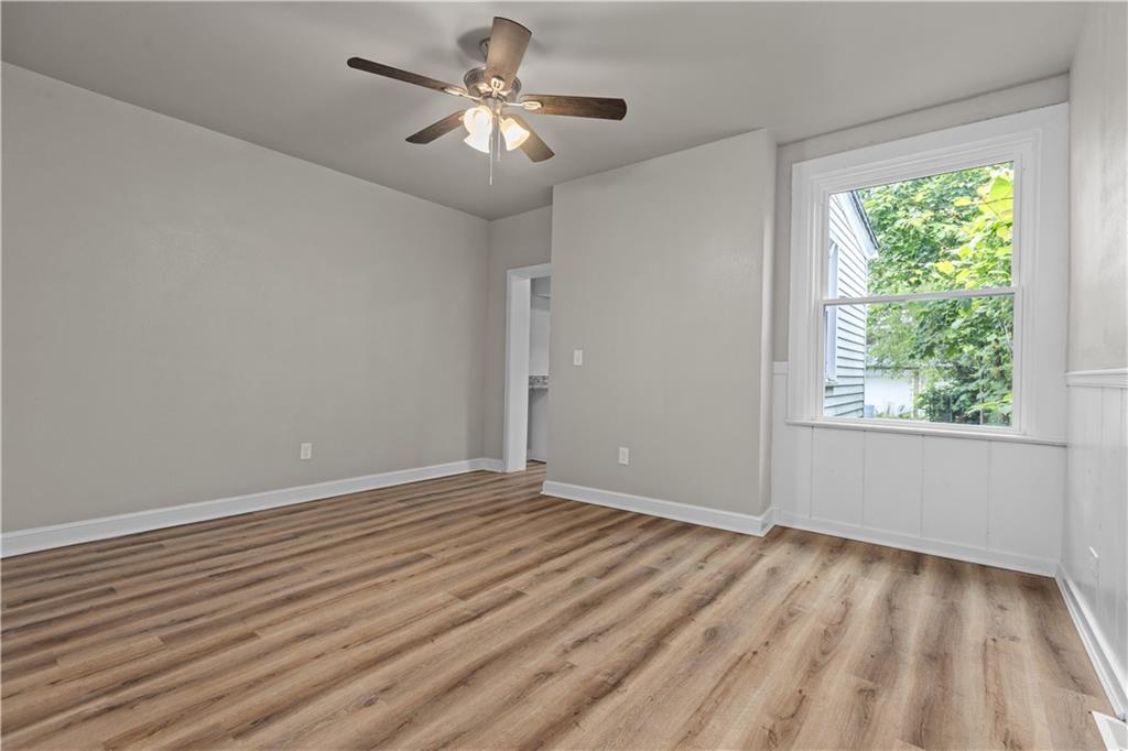 1238 Church Avenue McKees Rocks, PA 15136 - Photo 8 of 25 wooden floor in an empty room with a window