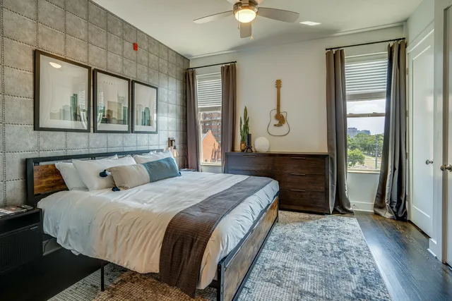 a bedroom with a bed and window