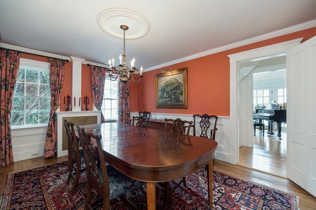 13 Main Street Boxford, MA 01921 - Photo 12 of 36 a dining room with furniture a chandelier and wooden floor