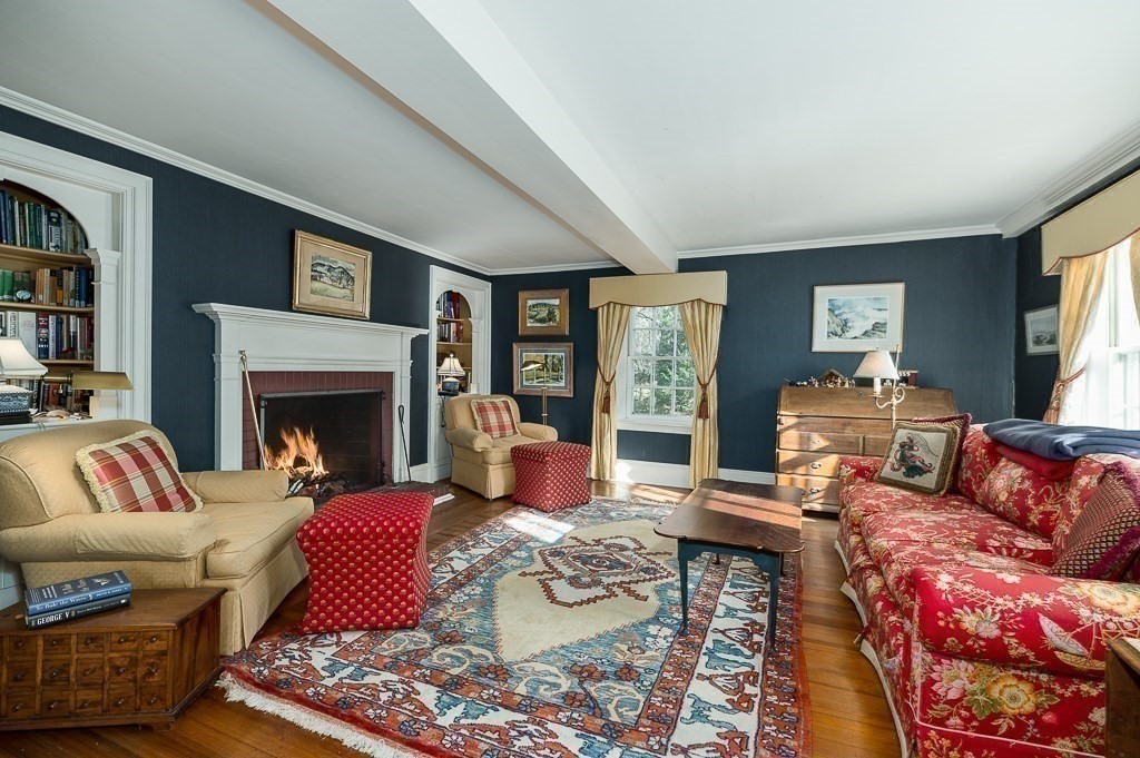 13 Main Street Boxford, MA 01921 - Photo 13 of 36 a living room with furniture and a fireplace