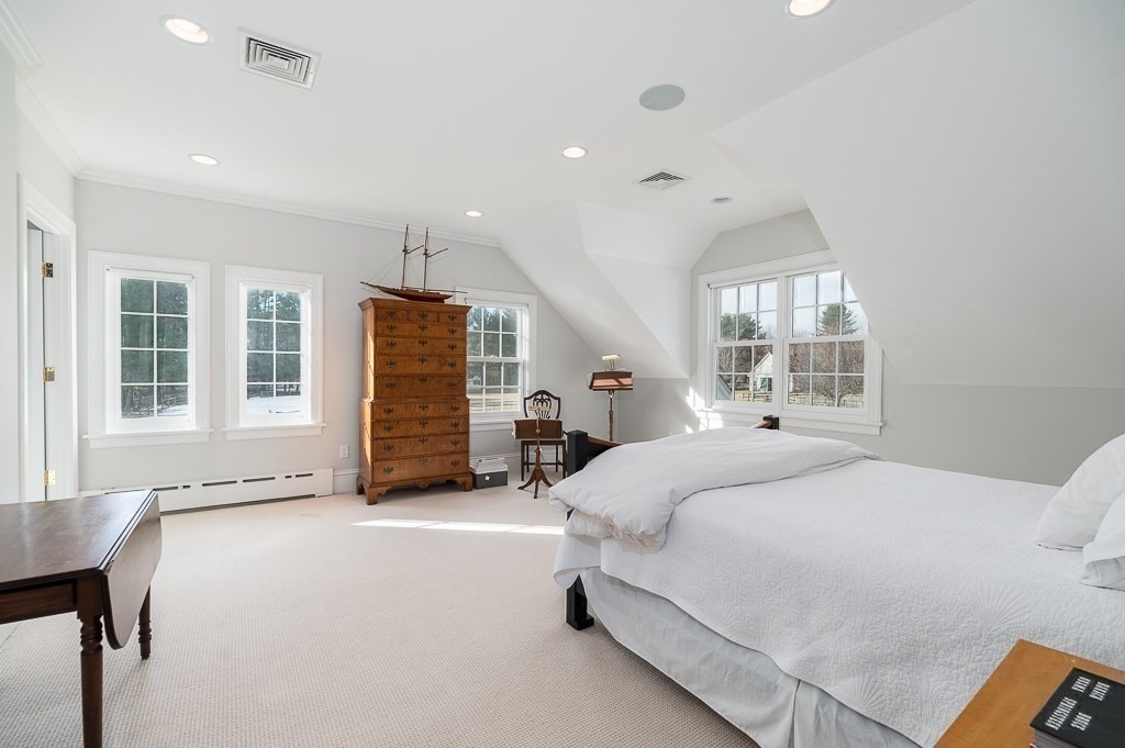 13 Main Street Boxford, MA 01921 - Photo 17 of 36 a bedroom with a bed next to a window