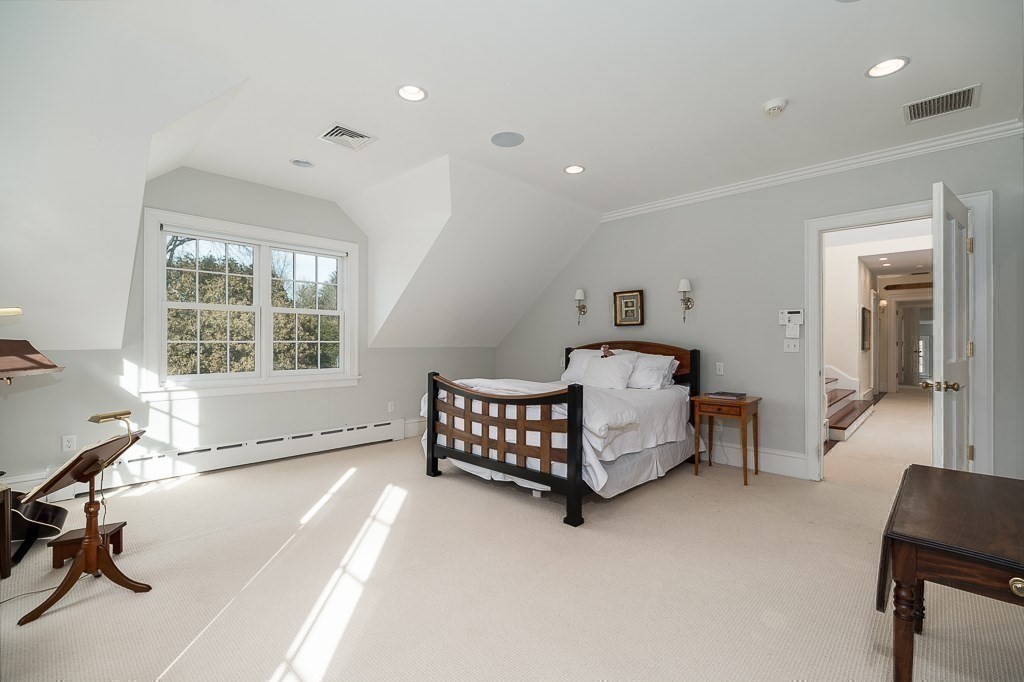 13 Main Street Boxford, MA 01921 - Photo 18 of 36 a bedroom with a bed and a desk