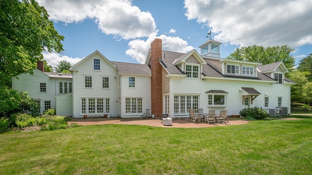 13 Main Street Boxford, MA 01921 - Photo 2 of 36 a front view of a house with garden