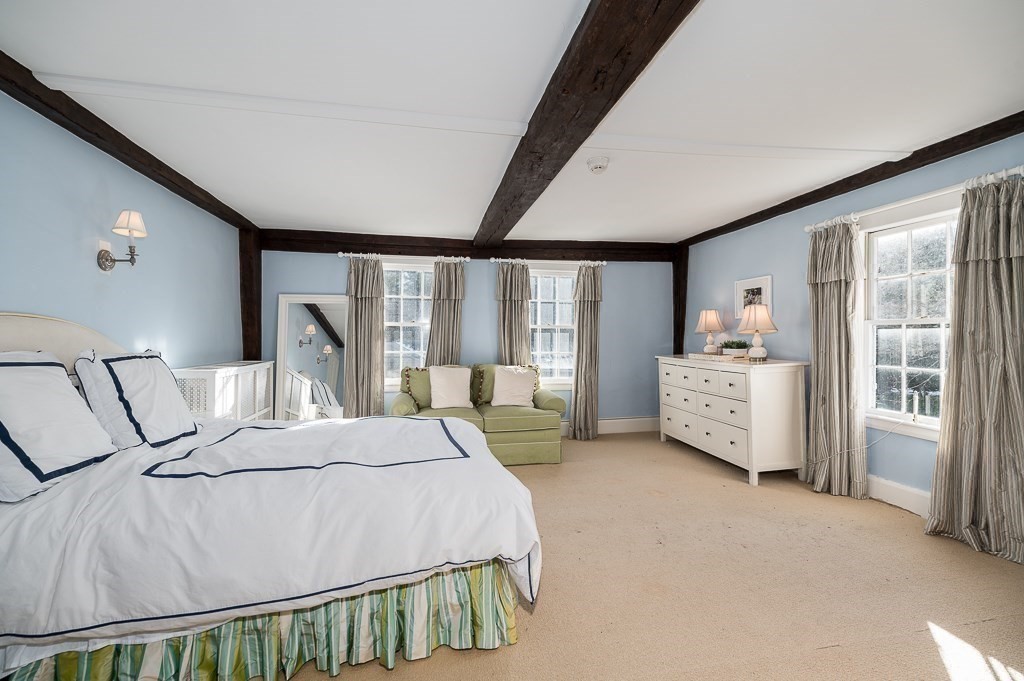 13 Main Street Boxford, MA 01921 - Photo 28 of 36 a bedroom with a large bed and a large window