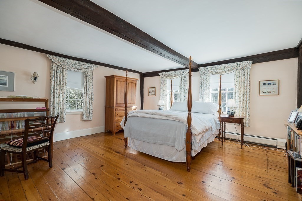 13 Main Street Boxford, MA 01921 - Photo 29 of 36 a bedroom with a bed wooden floor and window