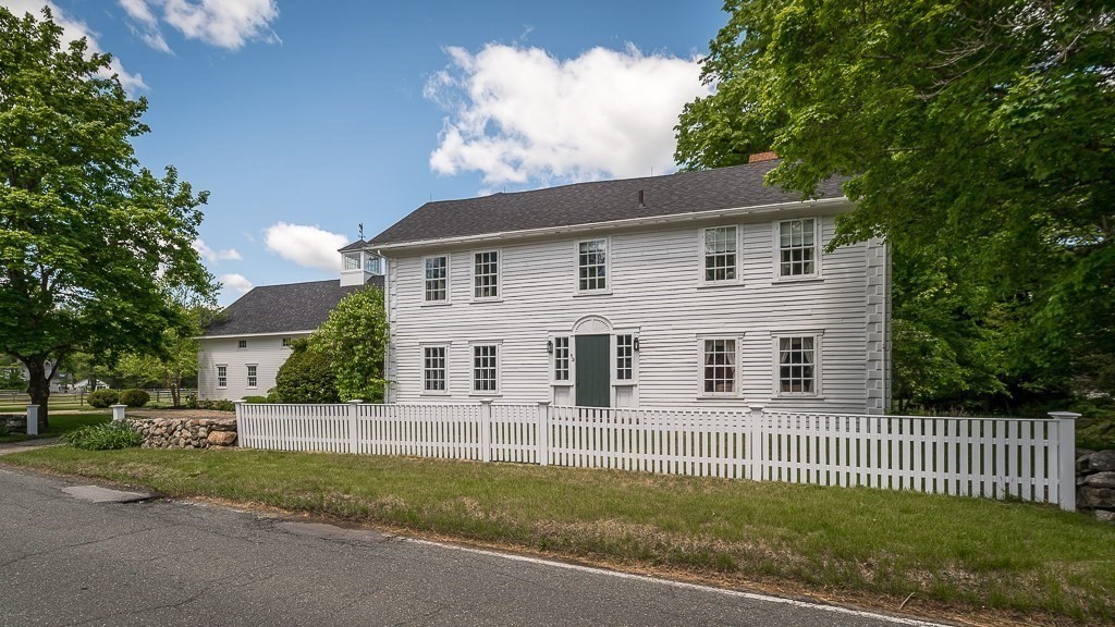 13 Main Street Boxford, MA 01921 - Photo 35 of 36 a front view of a house with a garden