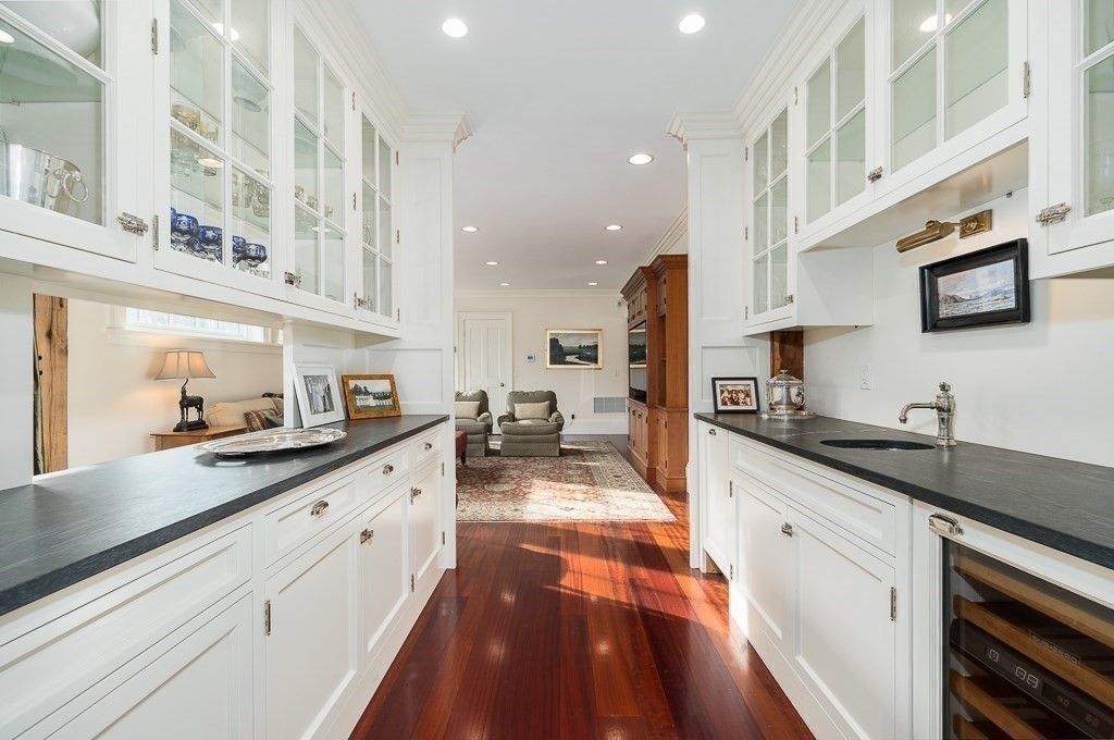 13 Main Street Boxford, MA 01921 - Photo 4 of 36 a large kitchen with stainless steel appliances kitchen island granite countertop a sink and cabinets