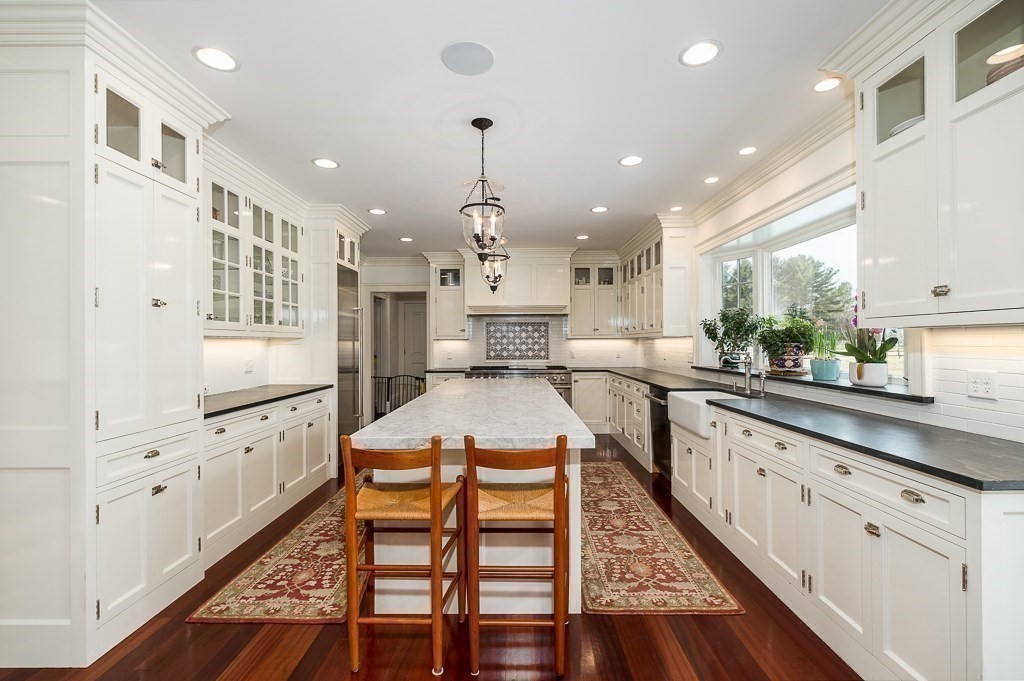 13 Main Street Boxford, MA 01921 - Photo 7 of 36 a large white kitchen with lots of counter space wooden floor and appliances