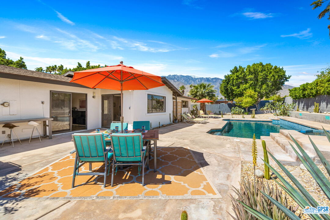 a view of a swimming pool with a patio