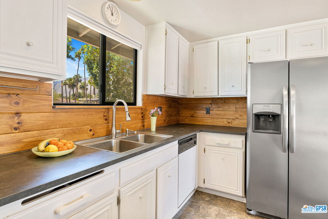 1250 East Delgado Road Palm Springs, CA 92262 - Photo 17 of 35 a kitchen with a sink and cabinets