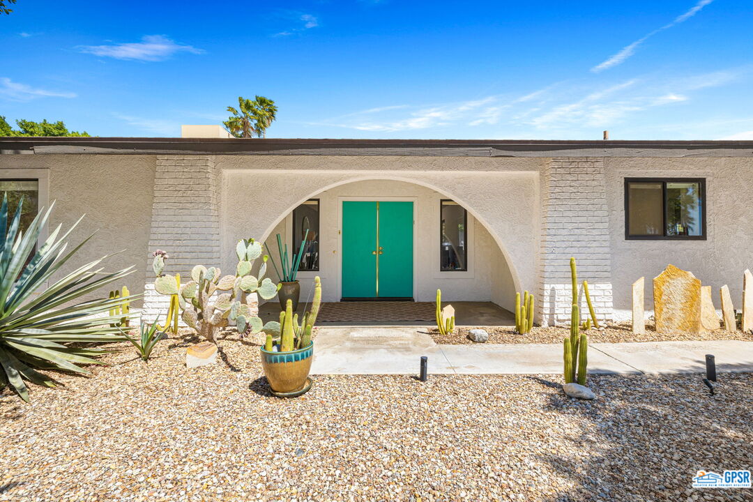 1250 East Delgado Road Palm Springs, CA 92262 - Photo 33 of 35 a front view of a house with a yard