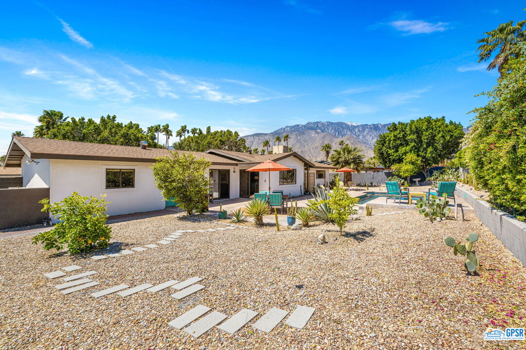 1250 East Delgado Road Palm Springs, CA 92262 - Photo 5 of 35 a view of a chair and table in the backyard