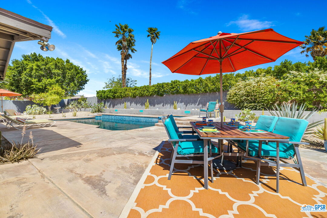 1250 East Delgado Road Palm Springs, CA 92262 - Photo 8 of 35 an outdoor space with furniture and umbrella