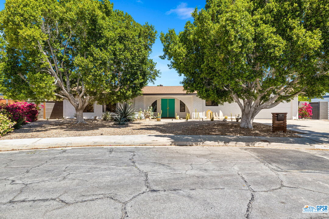 1250 East Delgado Road Palm Springs, CA 92262 - Photo 9 of 35 a front view of a house with a yard