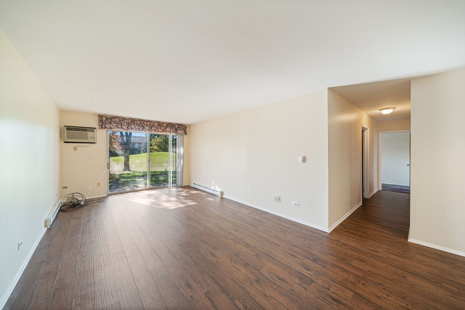 826 East Old Willow Road, Unit 103 Prospect Heights, IL 60070 - Photo 5 of 25 an empty room with wooden floor