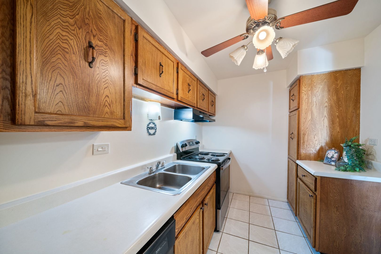 826 East Old Willow Road, Unit 103 Prospect Heights, IL 60070 - Photo 10 of 25 a kitchen with stainless steel appliances a sink a refrigerator and a stove