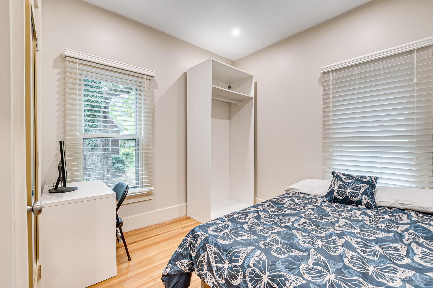 2015 Washington Valley Road Bridgewater, NJ 08836 - Photo 23 of 46 a bedroom with a bed and wooden floor